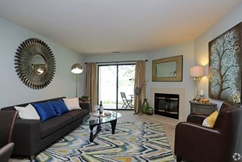 Relax in your living room with fireplace and plush carpeting